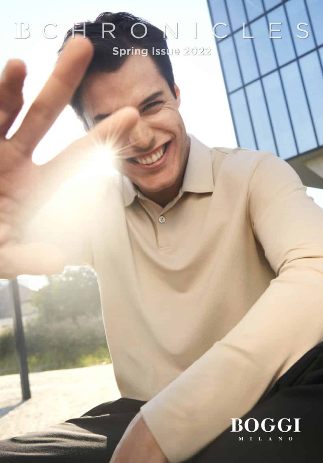 Guy smiling, wearing an off-white/beige shirt.