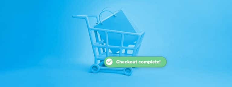 Ein Einkaufswagen auf blauem Hintergrund mit der Nachricht: "Checkout Complete", um auf einen geringeren Abbruch des Warenkorbs hinzuweisen.