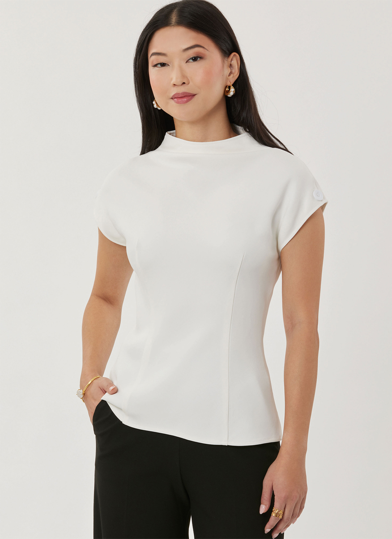 Woman in white short sleeve top