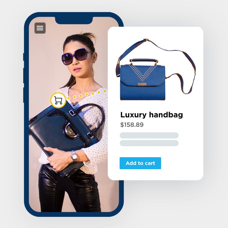 Interactive media on mobile phone. Woman holding luxury bag. Shopping cart icon shows luxury bag can be bought directly.